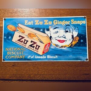 ZuZu Ginger Snaps Porcelain Enameled Advertising Sign